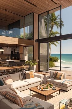 a living room filled with furniture next to an ocean view