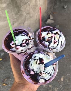 three ice cream sundaes in plastic cups