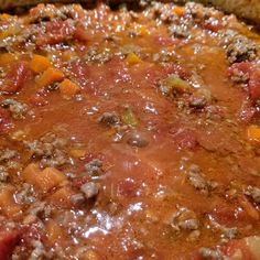 a pot filled with meat and vegetables on top of a stove