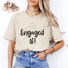 a woman wearing a t - shirt that says engaged af