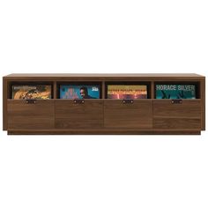 an entertainment center with bookshelves and drawers on the sides, in walnut finish