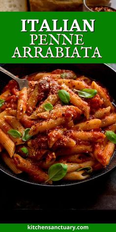 a pan filled with pasta and sauce on top of a table