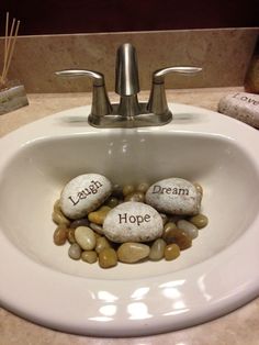 rocks in a sink with words written on them