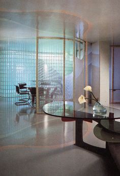 a glass table sitting in front of a window