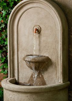 a fountain with water pouring out of it