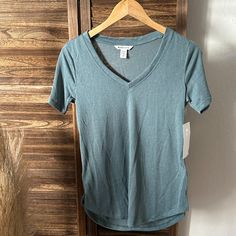 Athleta Breezy Scoop V Tee Brand New With Tags, Never Worn, Return Window Closed Size: Xs Color: Oxidized Green Fabric + Care: - Tencel Modal/Polyester - Lower Impact Material: Tencel Is A Fiber That Is Harvested From Responsibly Managed Forests Where 99% Of The Raw Material Comes From Certified Or Controlled Sources - Easy Care. Just Throw In The Wash And Dry Without A Second Thought - Breathable. Sweat Can Travel Through The Fabric So It Can Evaporate On The Surface Blue V-neck Athleisure Top, Sporty V-neck Tops For Loungewear, Green Fabric, Top Brands, Fabric Care, Brand New, Womens Tops, Tops & Tees, Women Shopping