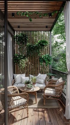 a covered porch with wicker furniture and potted plants