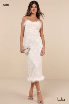 Make your entrance in an event-approved look like the Lulus Uniquely Confident Cream Lace Feather Strapless Midi Dress! Stretchy lace fabric boasts a scalloped design of applique braid, paired with shiny tonal sequins, for an eye-catching effect across this cute dress. Strapless neckline boasts trendy feather trim, with hidden no-slip strips and a fitted waist. Skirt has a figure-skimming effect as it falls to a midi hem with matching feather trim. Kick pleat and hidden zipper/clasp at back. Fit: This garment fits true to size. Length: Mid-calf length. Size medium measures 44" from top to bottom. Bust: Great for any cup size. Waist: Fitted - very fitted at natural waist. Hip: Fitted - stretchy fabric allows room for hips. Undergarments: May be worn with a strapless bra, adhesive bra, petal Vegas Elopement Dress, Scalloped Design, Midi Dress White, Vegas Elopement, Cream Lace Dress, Dress With Sequins, Sequin Midi Dress, Strapless Neckline, Feather Trim