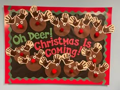 a christmas bulletin board with handprinted reindeers and the words oh deer, christmas is coming