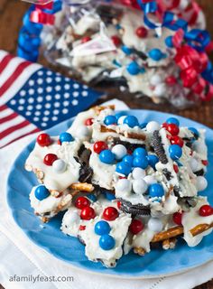 an american flag dessert on a blue plate with red, white and blue candies