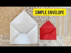 an origami envelope with red paper and the words simple envelope on top of it