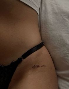 a woman's stomach with the word love written on it and an inscription in cursive writing