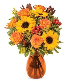 a vase filled with yellow and orange flowers