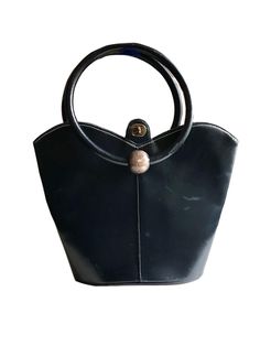 a gorgeous vintage 1940s 50s Art Deco swing era leather and lucite purse  this stylish handbag has a beautiful dark blue color and is made of very soft genuine leather. it has two beautiful circle shaped handles adorned with two striking large lucite marbled round knobs on each side in a warm taupe color. fully lined with blue rayon fabric, it has one large compartment and two side compartment.   in excellent vintage condition ,the condition of the leather is great, still soft and not dried out. 1950s Hollywood Glamour, 1950s Hollywood, Deco Blue, Evening Purse, Dark Blue Color, Change Purse, Taupe Color, Hollywood Glamour, Blue Leather