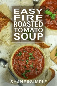 easy fire roasted tomato soup in two bowls with spoons and bread on the side