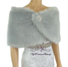 Our Silver Grey Faux Fur Wrap style; perfect matching for any color dresses.. this is a must have for your wedding dresses, Evening dresses, Prom dresses... or any special event that you are attending. you get the Luxuries style from this beautiful Silver Grey fur without sacrificing the life of our animal.  We also offer this in the color of white, Ivory, Gray, Grey Chinchilla, Champagne, Plum, Vintage Brown, Navy Blue and Black.  One size fits all, (standard US size).  ---------------------... Fur Shawl Wedding, Faux Fur Wedding, Faux Fur Shrug, Faux Fur Cape, Bridal Fur, Fur Shrug, Faux Fur Stole, Bridal Shrug, شال كروشيه