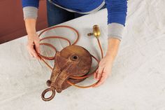 a woman is working on an octopus mask