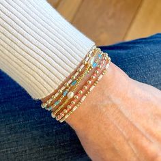 Stacked beaded bracelets with 14k gold fill balls Cute Seed Bead Bracelets Ideas, Beaded Bracelet Stacks, Dainty Beaded Bracelets, Small Bead Bracelets Ideas, Small Beaded Bracelets, Pretty Stacks, Bracelet Stack Ideas, Pearl Necklace Outfit, Bead Bracelet Stack