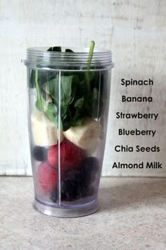 a blender filled with fruit and vegetables on top of a counter