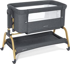 a baby crib that is sitting on top of a stand