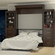 a bedroom with a bed, bookcase and dressers in the middle of it