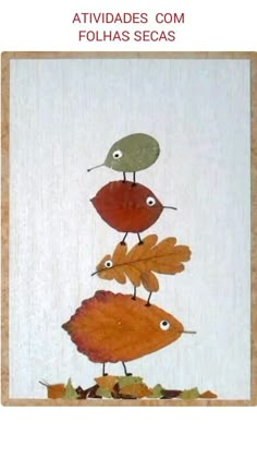 three little birds are standing on top of leaves and acorns in the air