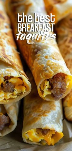 breakfast burritos with sausage and cheese are on a plate, ready to be eaten