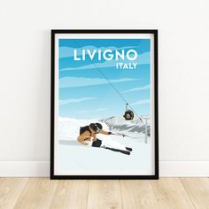 a framed poster with a skier going down the mountain on skis and holding onto a rope