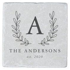 a monogrammed stone coaster with the letter a on it