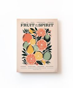 the fruit of the spirit book is displayed on a white surface with leaves and oranges