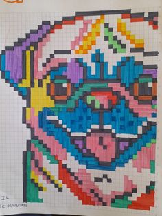 a piece of art made out of legos and colored pencils on top of a sheet of paper