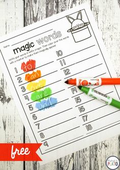 two crayons are sitting on top of a paper with the words magic words