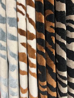 a bunch of different colored animal print fabric