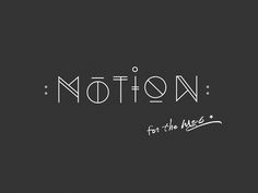 the word motion written in white ink on a black background with an inscription below it