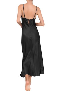 Fall in love with this smooth, satiny nightgown designed in a slinky silhouette with slender adjustable straps. 100% rayon Hand wash, dry flat Made in the USA of imported fabric Black Owned and Founded Modal Satin Sleepwear With Spaghetti Straps, Elegant Modal Satin Nightgown For Sleep, Satin Cami Sleepwear For Wedding Night, Silk V-neck Nightgown For Night, Elegant Camisole Nightgown With Built-in Bra, Night Dress With Satin Trim, Silk Slip Dress With Satin Finish For Sleep, Night Dress With Spaghetti Straps And Satin Finish, Evening Slip Dress With Satin Lining And Spaghetti Straps