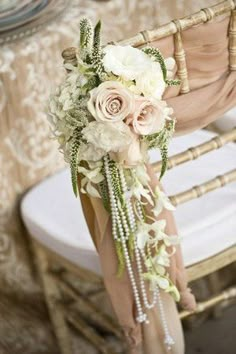 a bouquet of flowers sitting on top of a chair