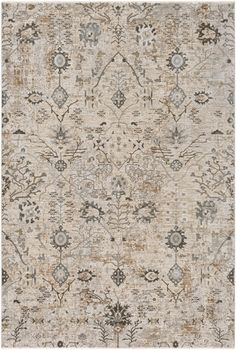 an area rug with various colors and patterns on the ground, including beiges, browns,