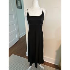 Top Of Dress Is Satin-Like Black Bias Cut Maxi Slip Dress, Flowy Dresses For A Night Out, Black Silk A-line Maxi Dress, Lined Midi Slip Dress For Formal Events, Lined Midi Length Slip Dress For Formal Events, Lined Midi Slip Dress For Formal Occasions, Black Silk Midi Dress With Bias Cut, Black Sleeveless Midi Dress With Bias Cut, Fitted Black Midi Dress With Bias Cut