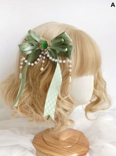 Enhance your hairstyle with our charming green beaded chains bowknot hairclip. This exquisite accessory features a delicate green bow adorned with shimmering beads and elegant chain details, adding a touch of sophistication to any look. Perfect for both casual and formal occasions, this hairclip effortlessly combines style and functionality, ensuring your hair stays in place while you shine. Embrace a blend of kawaii and chic with this must-have hair accessory. Fairy Core Hair Accessories, Whimsical Hair Accessories, Jade Hair Accessories, Light Green Accessories, Kawaii Accessories Hair, Cottagecore Hair Accessories, Green Hair Accessories, Cottagecore Hair, Pacifica Northwest