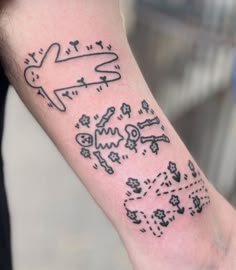 a person with a tattoo on their arm that has words and symbols all over it