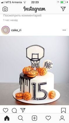 a white cake with black icing and basketballs on it