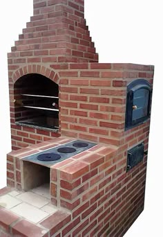 an outdoor brick oven with the door open