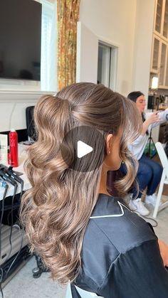 a woman getting her hair done in a salon