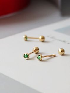 🍃--Details-- Handmade item Materials: Solid Gold (no gold filled or gold plated) Gold Kt: 14K Gemstone: Emerald  Gem colour:Green Style: Minimalist & Modern & Classic Made to Order 🍃--Description-- ❤️All components of the Earrings are genuine 14ct Gold. ❤️14K Solid Gold Emerald Green Gemstone Tiny Stud Earrings, 14K Real Gold Emerald ball end piercing, Cartilage Helix 2nd/3rd earlobe Piercings 🍃Earrings Features  ✪ 14k Solid Gold  (no gold filled or gold plated) ✪ AAA Grade Lab Grown Green Paraiba Tourmaline ✪ Earring size : 2.8*2.8mm ✪ Thickness: 0.8 mm ✪ Gold Colour : Yellow Gold ✪ Made to Order  --Others Information--  🔧Making:  WIQEE Jewels' pieces made to order. Please allow 4 - 8 business days for manufacturing. Need it sooner? Just ask and we will let you know if it's possible o Stud Gold Earrings, Small Emerald Earrings, Dainty Gold Emerald Earrings, Hand-set Emerald Gold Earrings, 14k Gold Green Pierced Earrings, Green Stud Earrings, Green Stud Earrings Gold, Real Gold Jewelry, Tourmaline Earrings