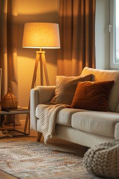 a living room scene with focus on the couch and lamp in the corner, along with other furniture