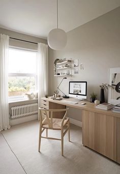 an ikea desk and chair in front of a window