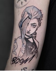 a woman's arm with a tattoo on it