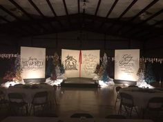 an empty room with tables and chairs set up for a wedding