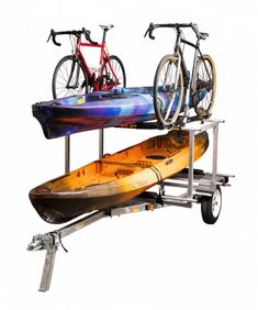 a kayak with two bikes on it is attached to a rack