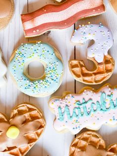 many different types of donuts on a table